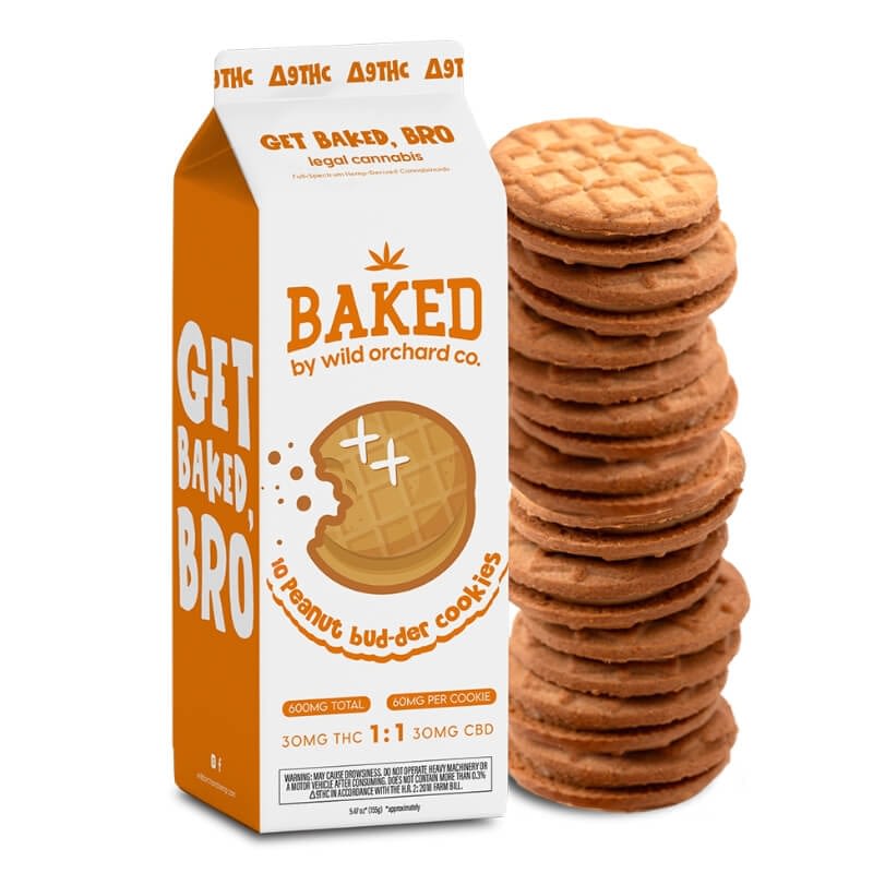 A carton of Baked Delta-9 Peanut Bud-der Cookies is shown next to a stack of cookies, emphasizing its THC and CBD content on the packaging.